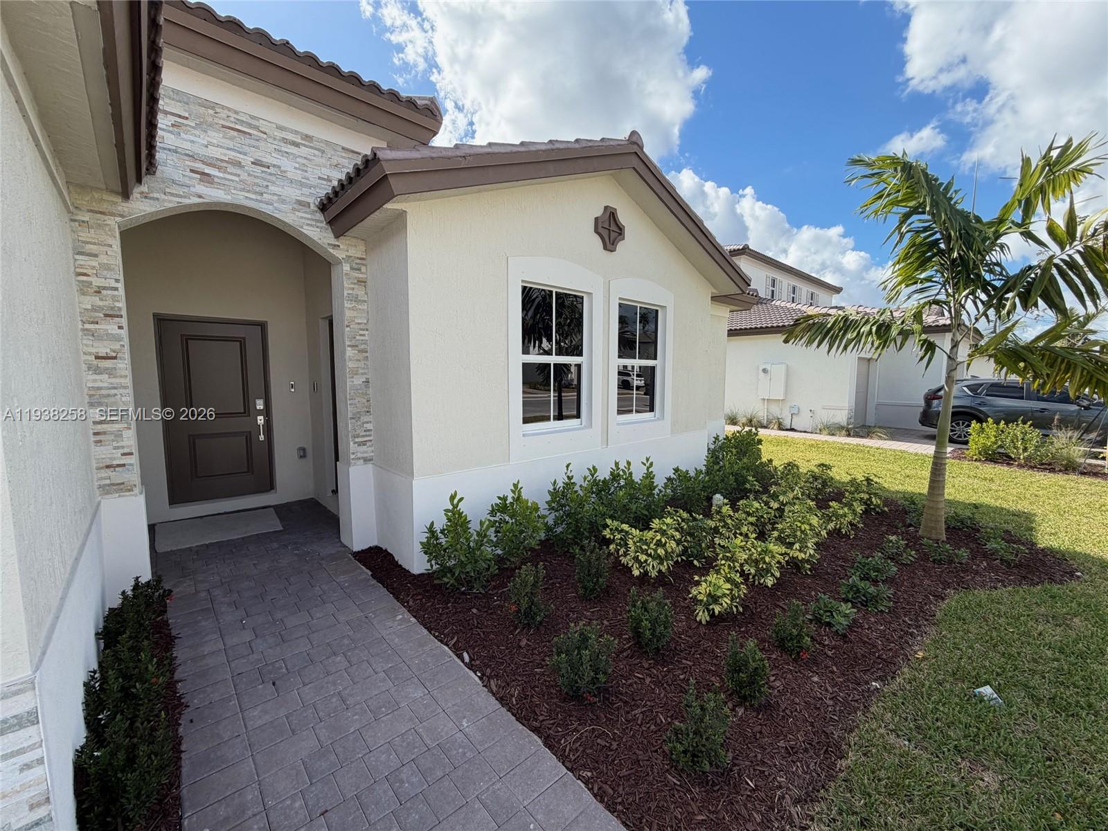 2256 Southeast 30th Street, Unit 2256 Homestead, FL 33035 - Photo 28 of 29 a view of a house with a yard