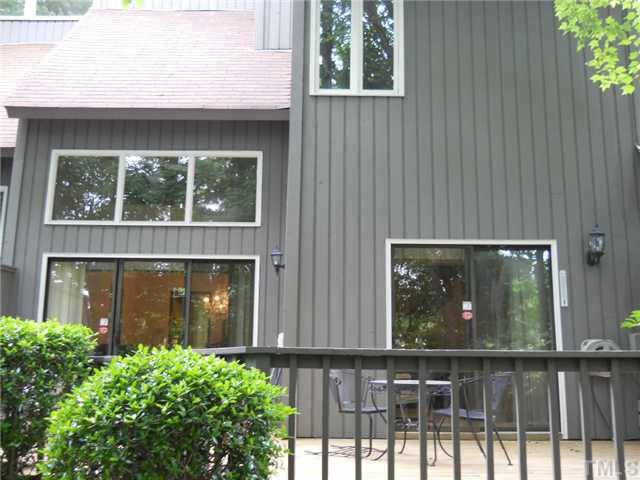 4347 Sunscape Lane Raleigh, NC 27613 - Photo 14 of 14 Back of home showing all the wonderful windows making the home very light and bright.