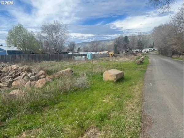 a swimming pool with lots of green space