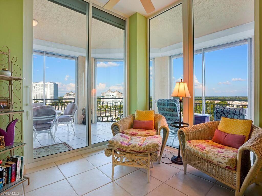 425 Dockside Drive, Unit PH1 Naples, FL 34110 - Photo 21 of 34 a outdoor living space with furniture and a floor to ceiling window