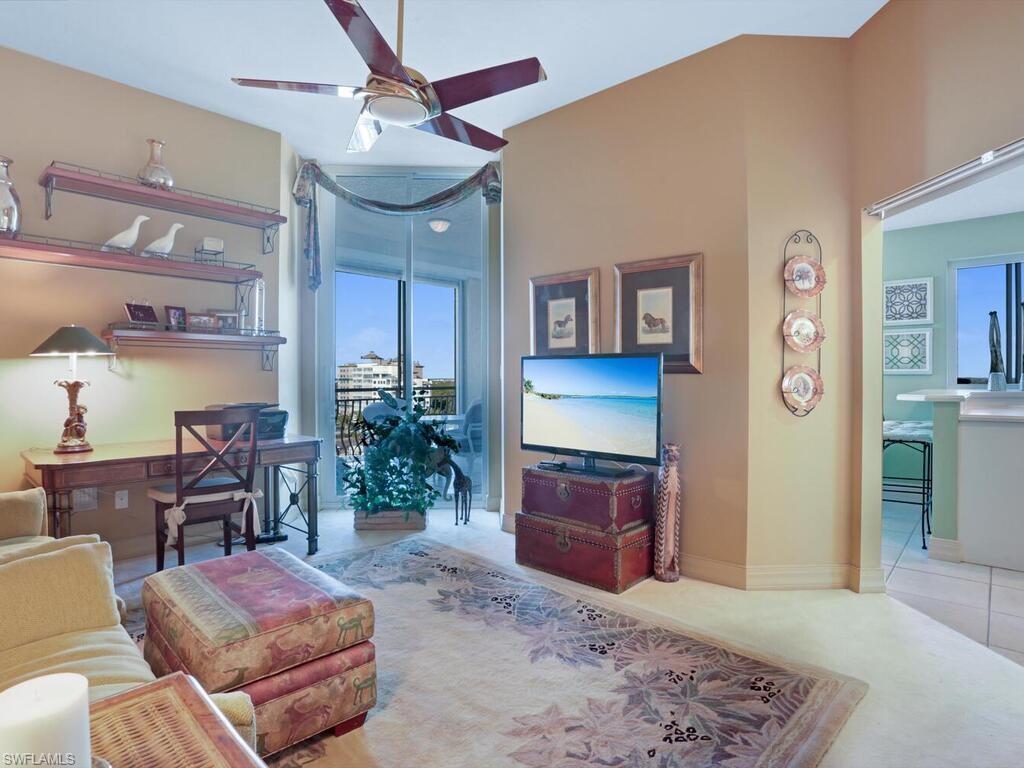 425 Dockside Drive, Unit PH1 Naples, FL 34110 - Photo 22 of 34 a living room with furniture and wooden floor