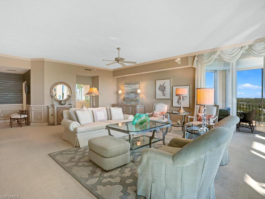 425 Dockside Drive, Unit PH1 Naples, FL 34110 - Photo 7 of 34 a living room with furniture and a large window