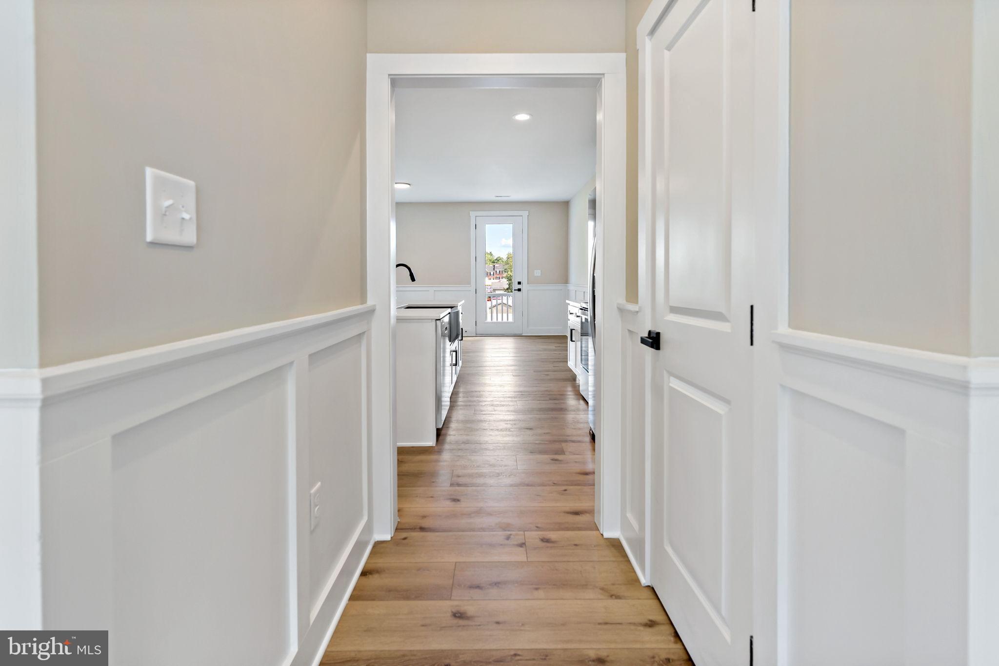412 East 7th Avenue Ranson, WV 25438 - Photo 10 of 36 Inviting hallway leading to a bright kitchen.