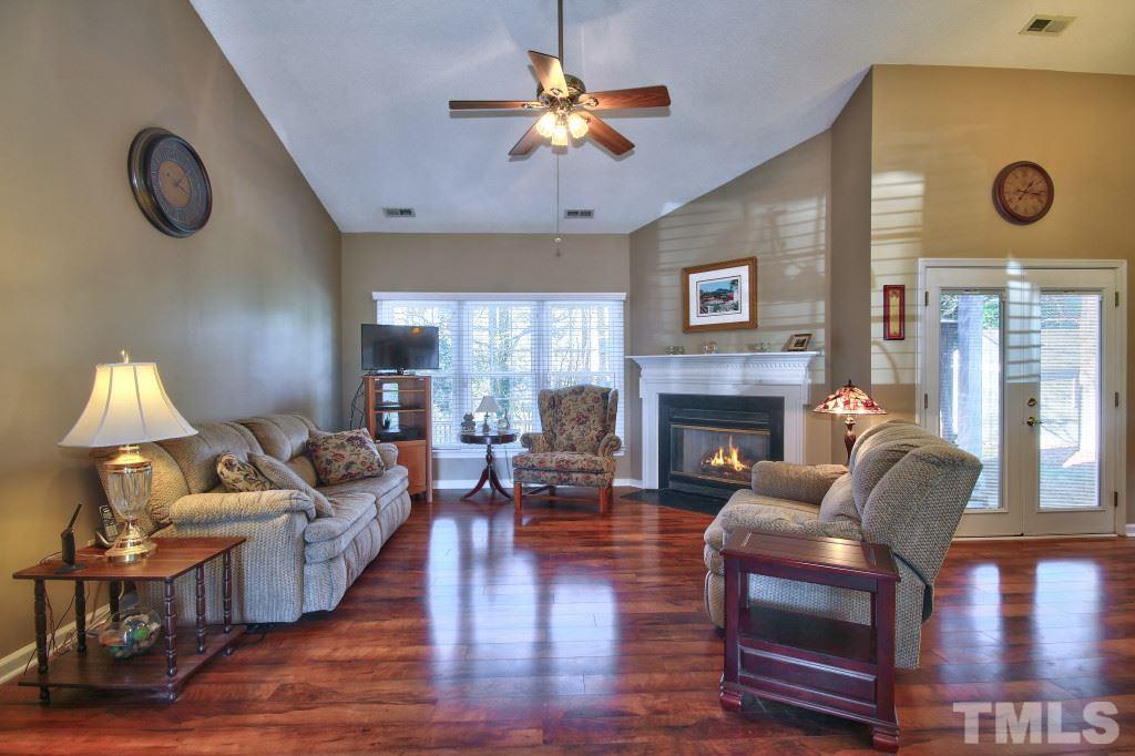 12225 Jarden Court Raleigh, NC 27613 - Photo 5 of 20 a living room with furniture fireplace and a large window