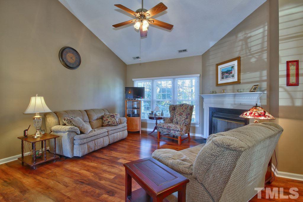 12225 Jarden Court Raleigh, NC 27613 - Photo 6 of 20 a living room with furniture and a fireplace