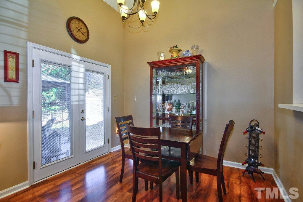 12225 Jarden Court Raleigh, NC 27613 - Photo 7 of 20 a view of a dining room with furniture window and wooden floor