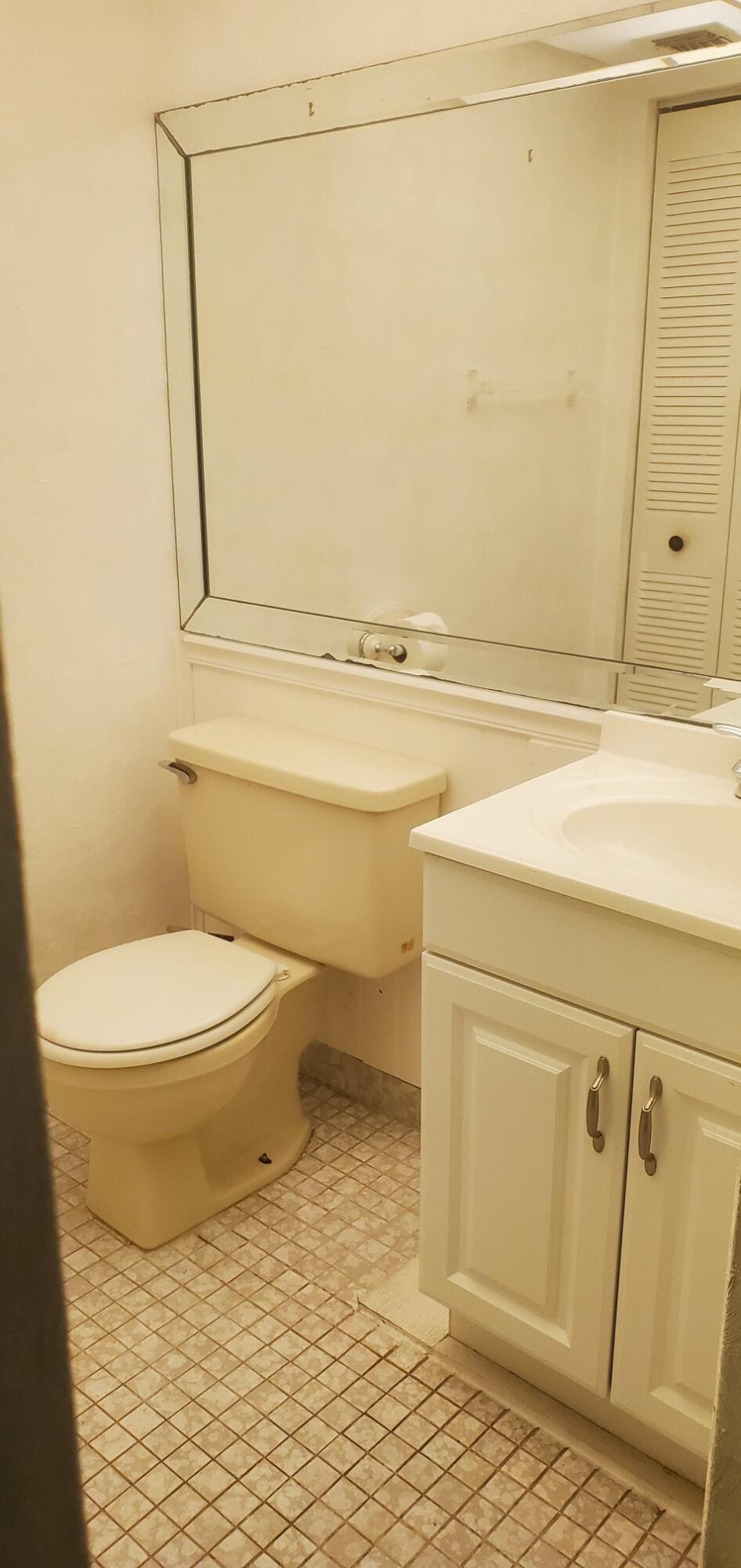 214 Capri East Delray Beach, FL 33484 - Photo 19 of 20 a bathroom with a toilet and a shower