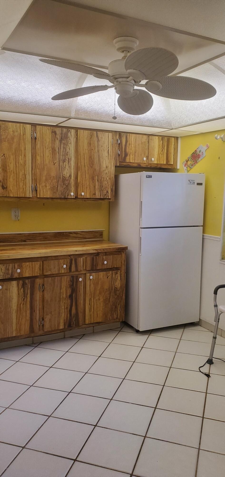 214 Capri East Delray Beach, FL 33484 - Photo 20 of 20 a kitchen with a cabinets and a window
