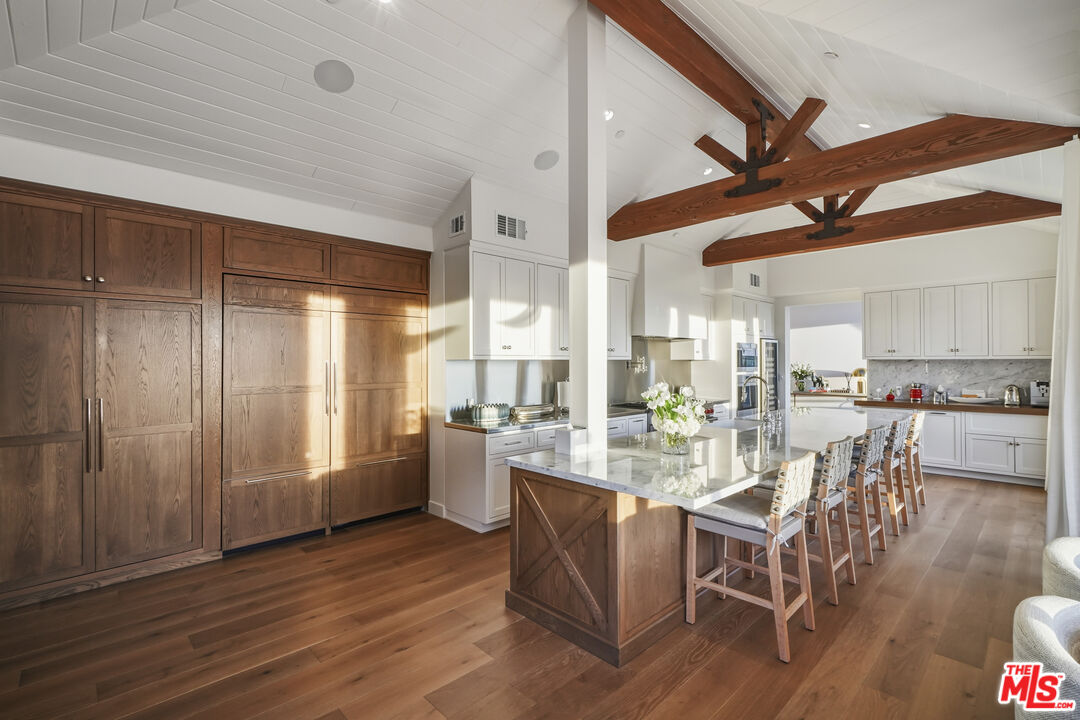 3140 Sweetwater Mesa Road Malibu, CA 90265 - Photo 15 of 71 a view of a dining room with furniture window and wooden floor