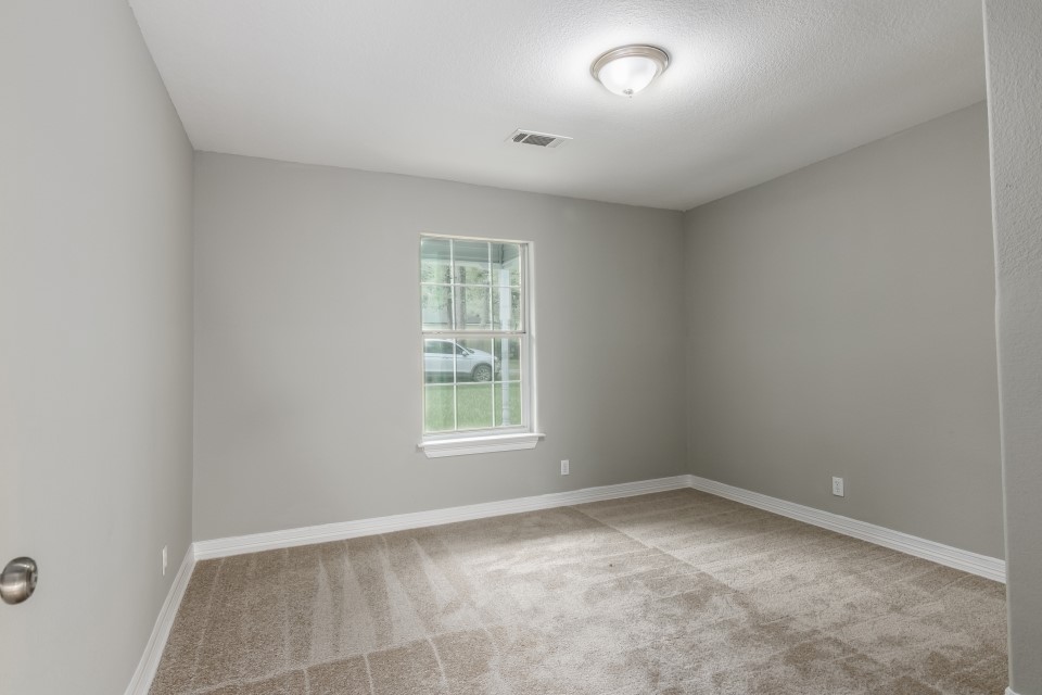 512 North Inwood Drive Bridge City, TX 77611 - Photo 11 of 18 an empty room with a window