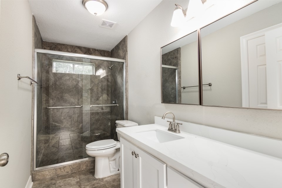 512 North Inwood Drive Bridge City, TX 77611 - Photo 13 of 18 a bathroom with a sink a toilet and shower