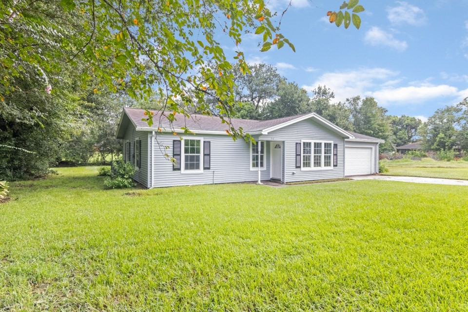512 North Inwood Drive Bridge City, TX 77611 - Photo 2 of 18 a view of a house with backyard and garden