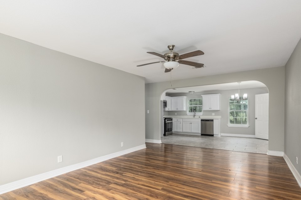 512 North Inwood Drive Bridge City, TX 77611 - Photo 5 of 18 an empty room with wooden floor and window