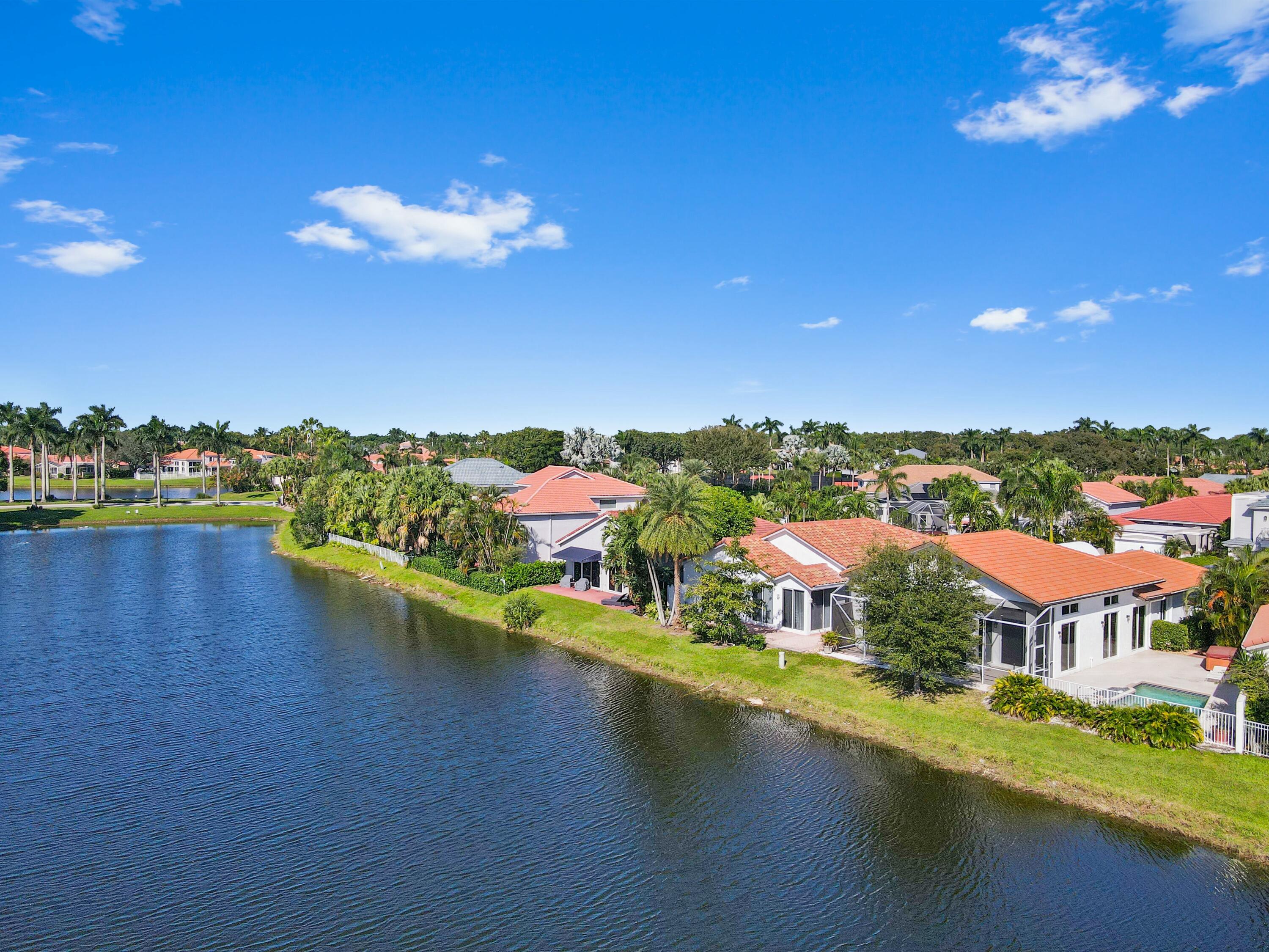 17272 Hampton Boulevard Boca Raton, FL 33496 - Photo 32 of 33 a view of a lake with houses lake view and boat