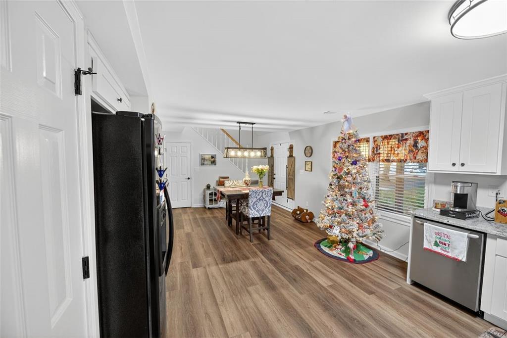 76 Walker Road Northwest Cartersville, GA 30121 - Photo 11 of 33 a living room with furniture and wooden floor