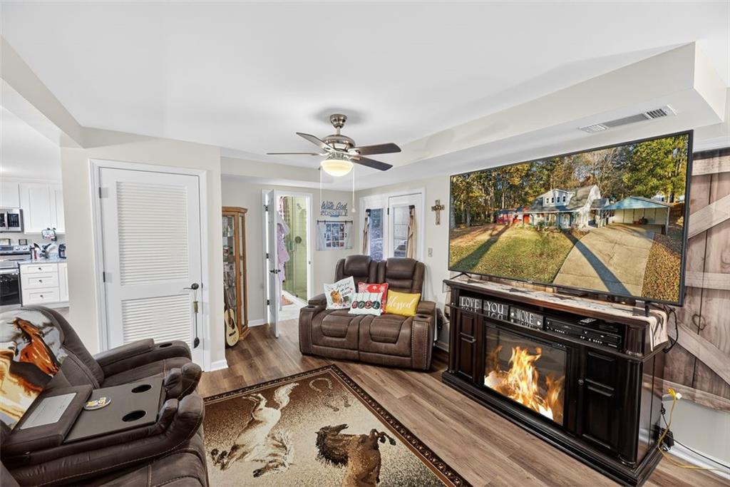 76 Walker Road Northwest Cartersville, GA 30121 - Photo 12 of 33 a living room with furniture and a fireplace