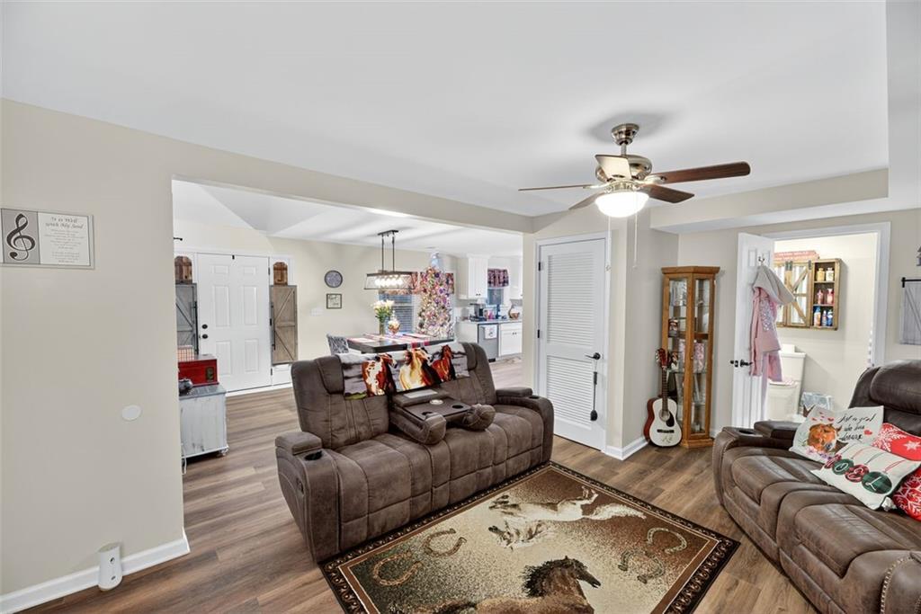 76 Walker Road Northwest Cartersville, GA 30121 - Photo 13 of 33 a living room with furniture and wooden floor