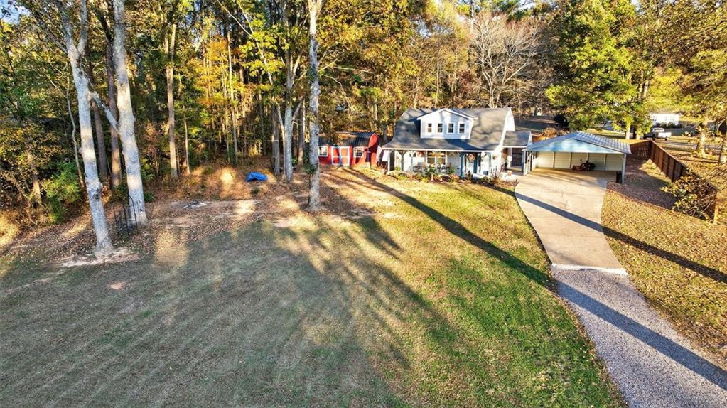 76 Walker Road Northwest Cartersville, GA 30121 - Photo 25 of 33 a swimming pool with outdoor seating and yard