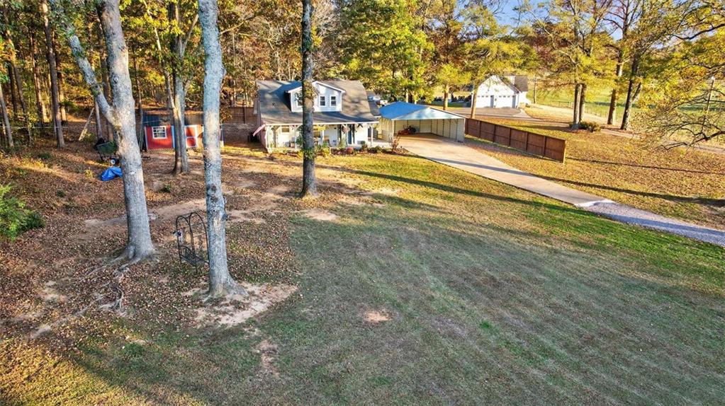 76 Walker Road Northwest Cartersville, GA 30121 - Photo 27 of 33 a view of a houses with yard
