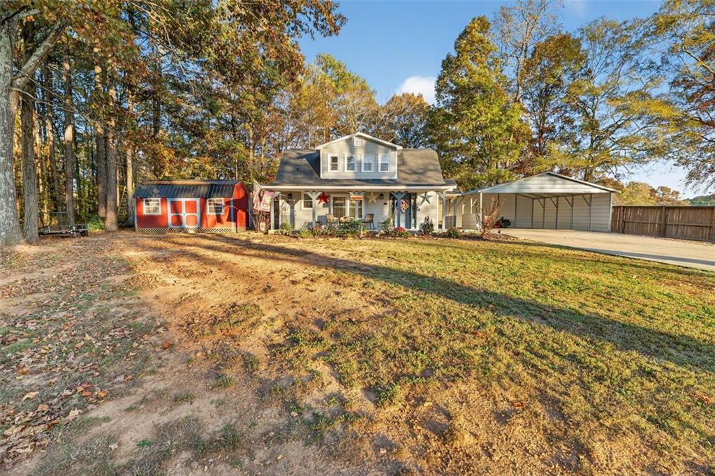76 Walker Road Northwest Cartersville, GA 30121 - Photo 29 of 33 front view of a house with a yard