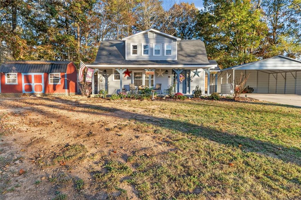76 Walker Road Northwest Cartersville, GA 30121 - Photo 30 of 33 a front view of a house with garden