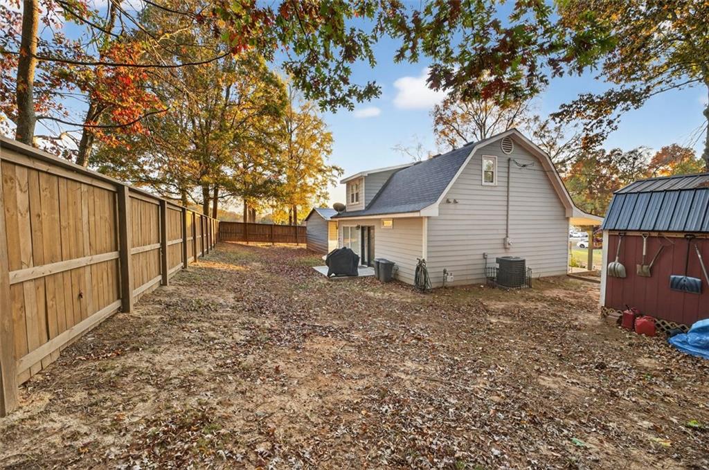 76 Walker Road Northwest Cartersville, GA 30121 - Photo 4 of 33 a view of a house with backyard