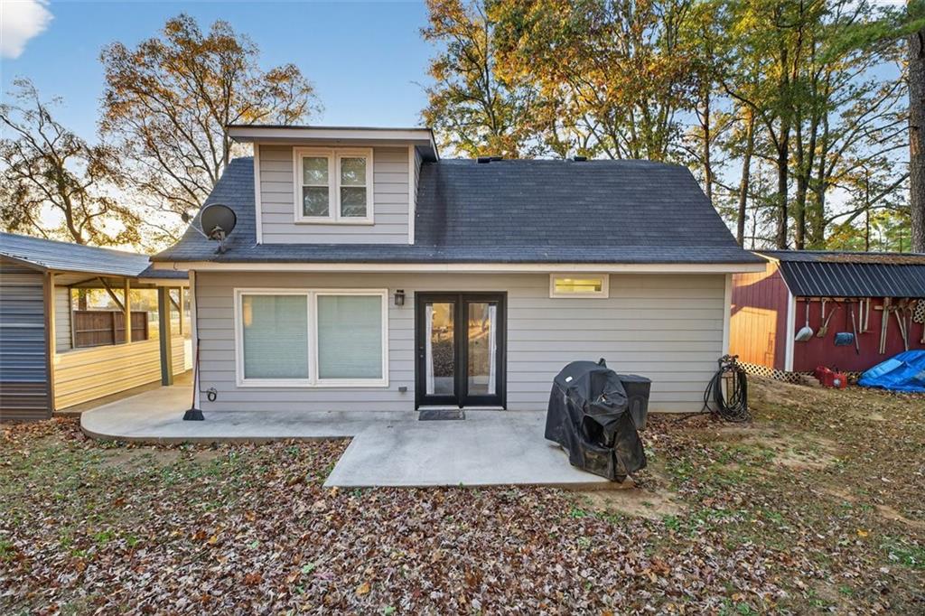 76 Walker Road Northwest Cartersville, GA 30121 - Photo 5 of 33 a front view of a house with garden
