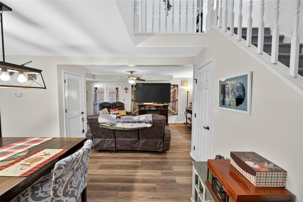 76 Walker Road Northwest Cartersville, GA 30121 - Photo 7 of 33 a living room with furniture and a flat screen tv