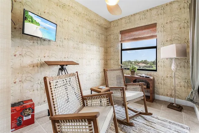 a view of a living room with a table and chair