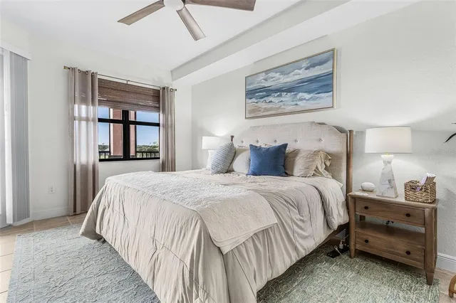 a bedroom with bed and wooden floor