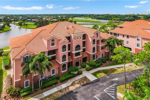 a aerial view of multiple houses with a yard