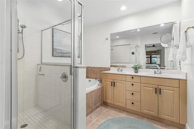 a spacious bathroom with a shower sink and mirror