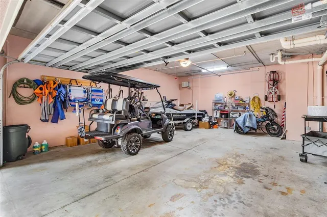 an aerial view of a house with a yard and a trees