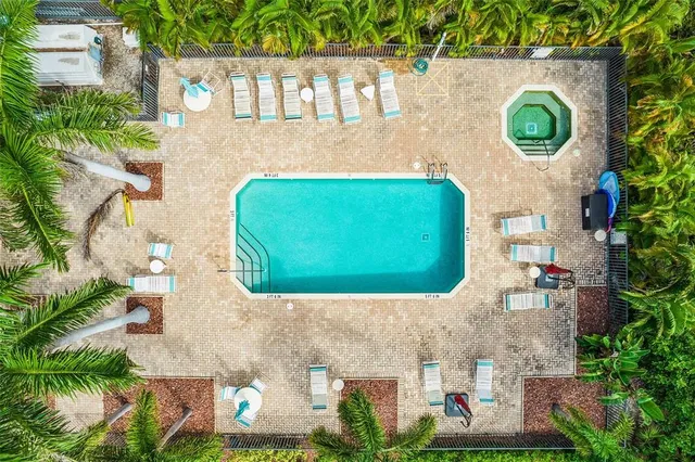 a view of a backyard with sitting area