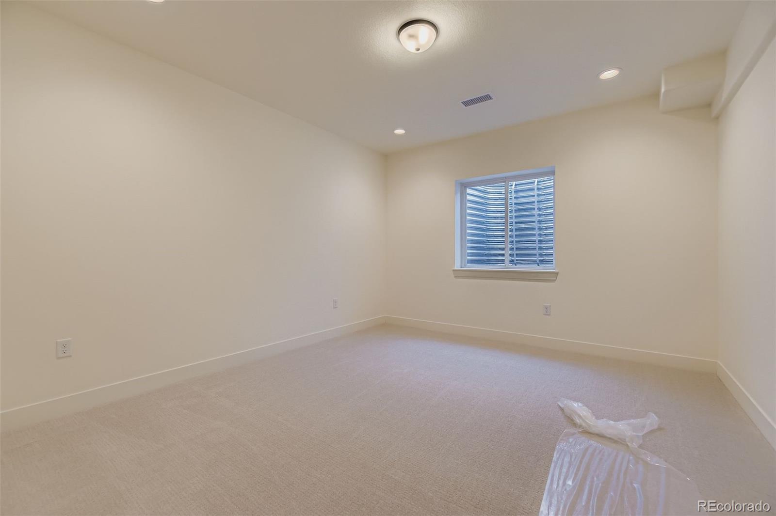 8942 South Riviera Way Aurora, CO 80016 - Photo 21 of 29 an empty room with a window
