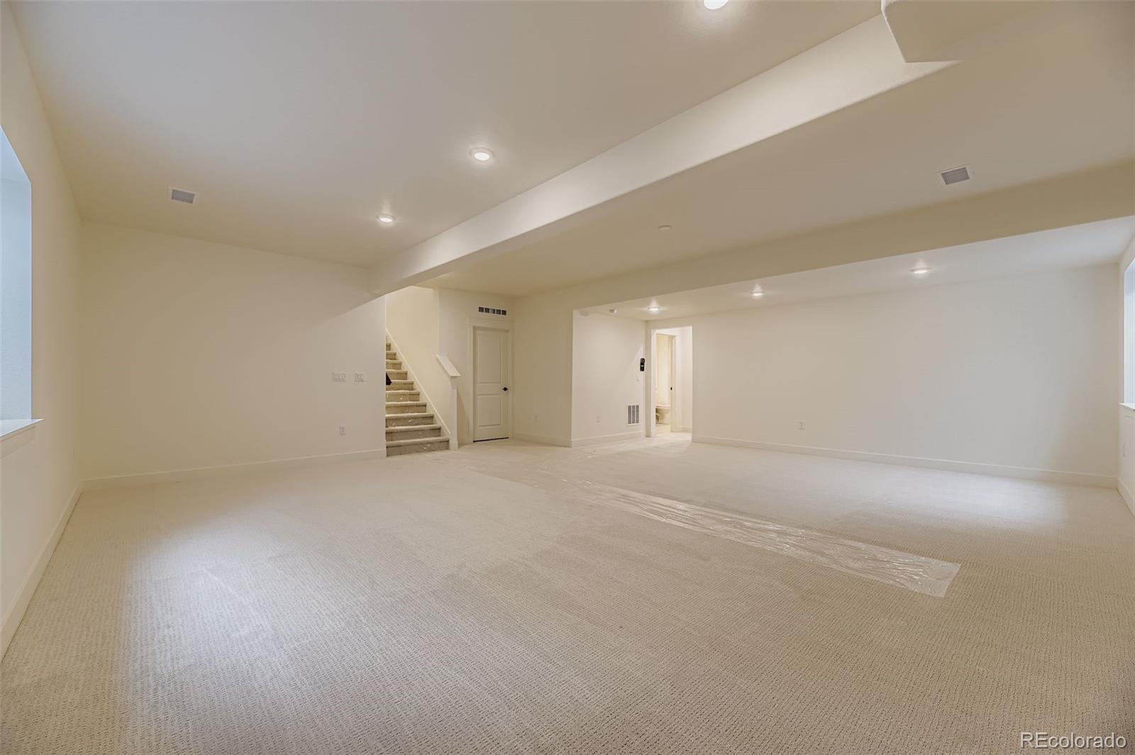 8942 South Riviera Way Aurora, CO 80016 - Photo 23 of 29 an empty room with white walls
