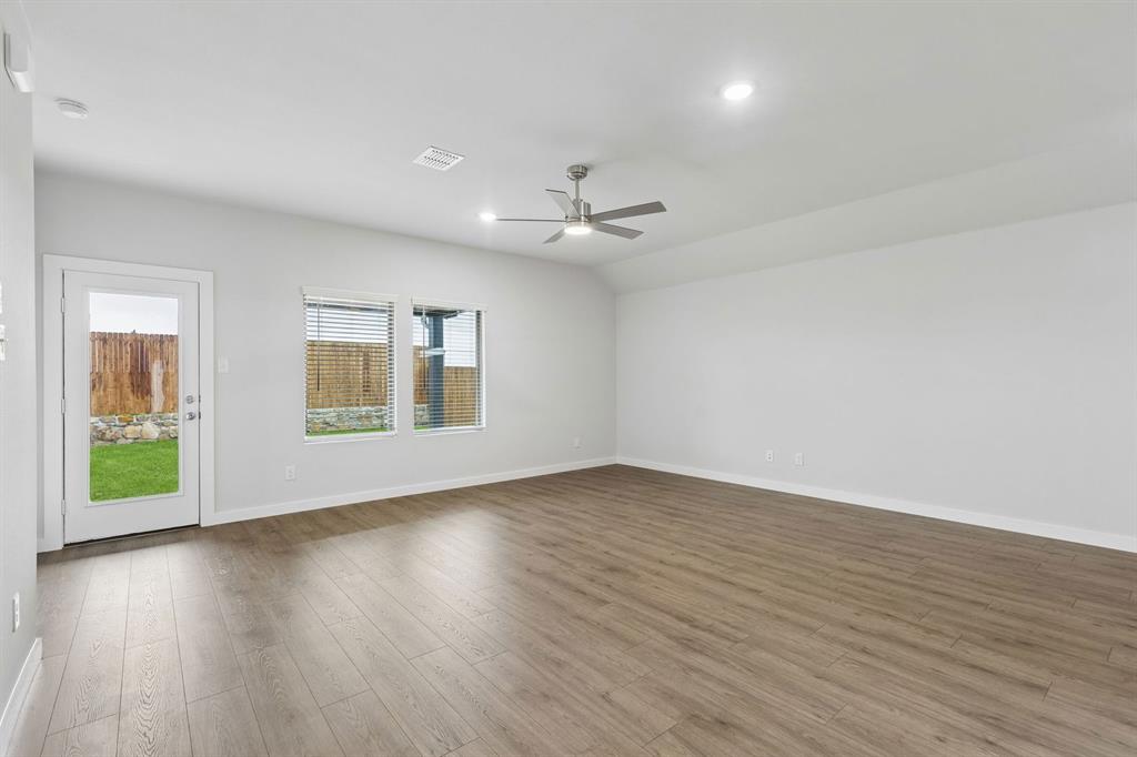 1140 Del Rio Drive Lavon, TX 75166 - Photo 10 of 32 Living Room in the Oscar home plan by Trophy Signature Homes – REPRESENTATIVE PHOTO