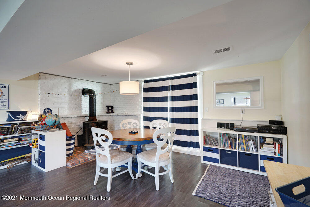 557 Summit Drive Point Pleasant, NJ 08742 - Photo 17 of 41 a view of a dining room with furniture and wooden floor