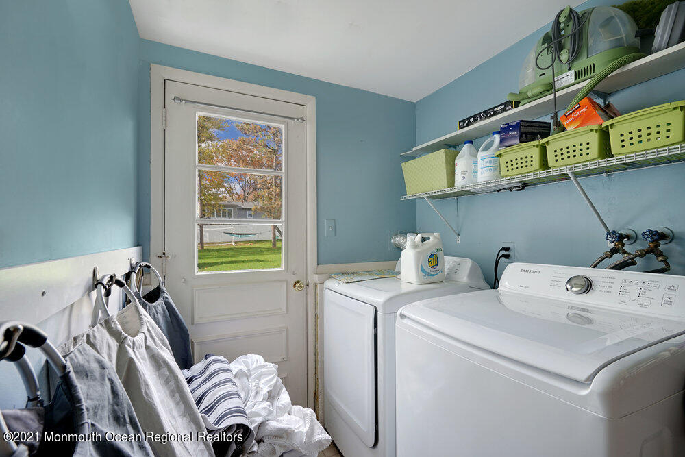 557 Summit Drive Point Pleasant, NJ 08742 - Photo 20 of 41 a view of storage and utility room with washer and dryer