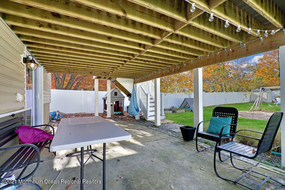 557 Summit Drive Point Pleasant, NJ 08742 - Photo 31 of 41 a backyard of a house with barbeque oven table and chairs
