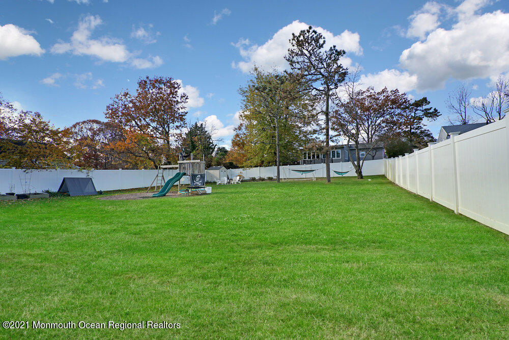 557 Summit Drive Point Pleasant, NJ 08742 - Photo 32 of 41 a view of a garden with a slide