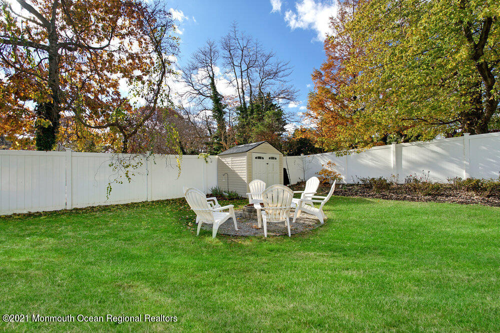 557 Summit Drive Point Pleasant, NJ 08742 - Photo 36 of 41 a view of a wooden bench sitting in the grass