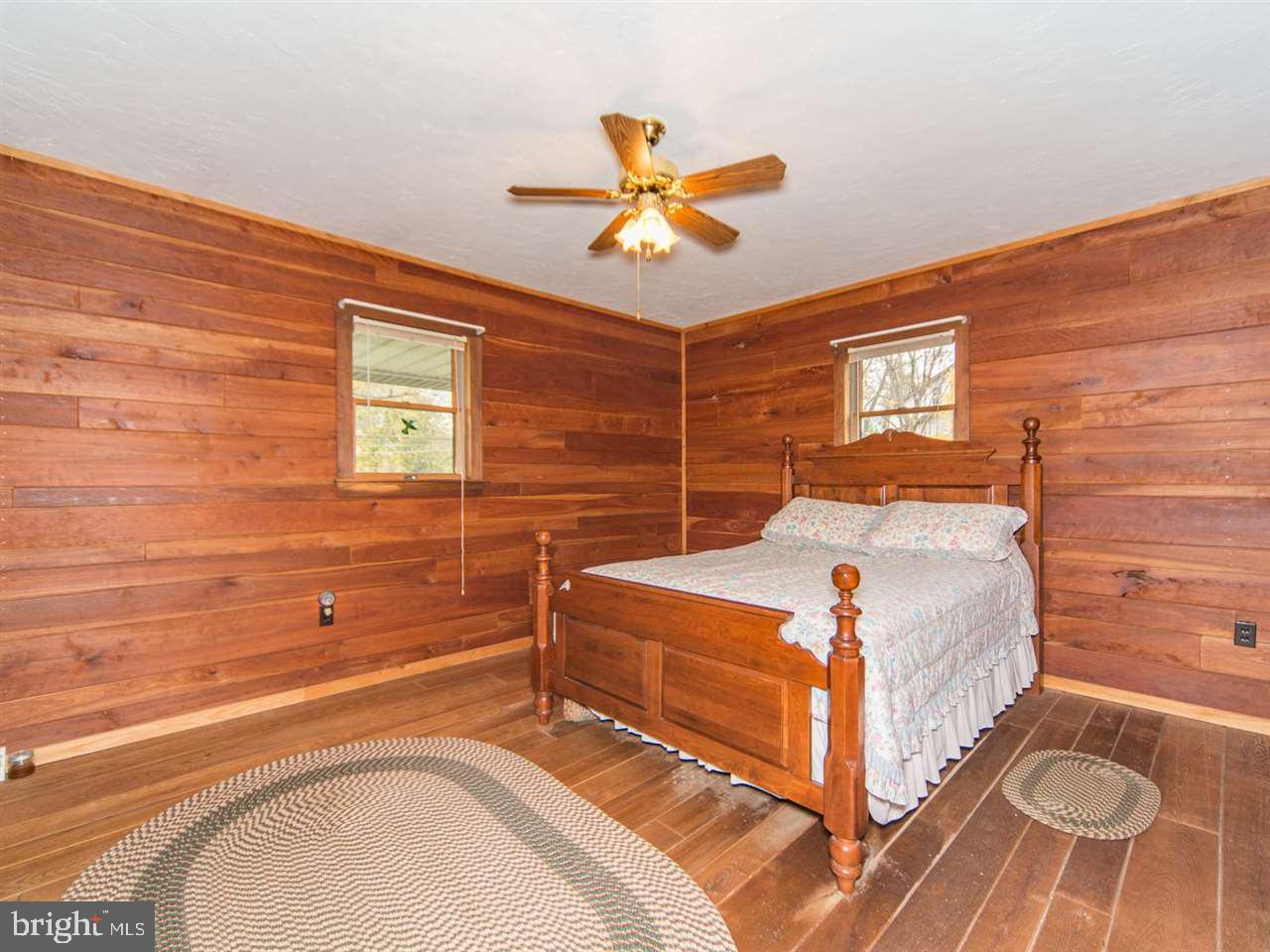 6322 York Road Spring Grove, PA 17362 - Photo 19 of 35 a bedroom with a bed and a chandelier