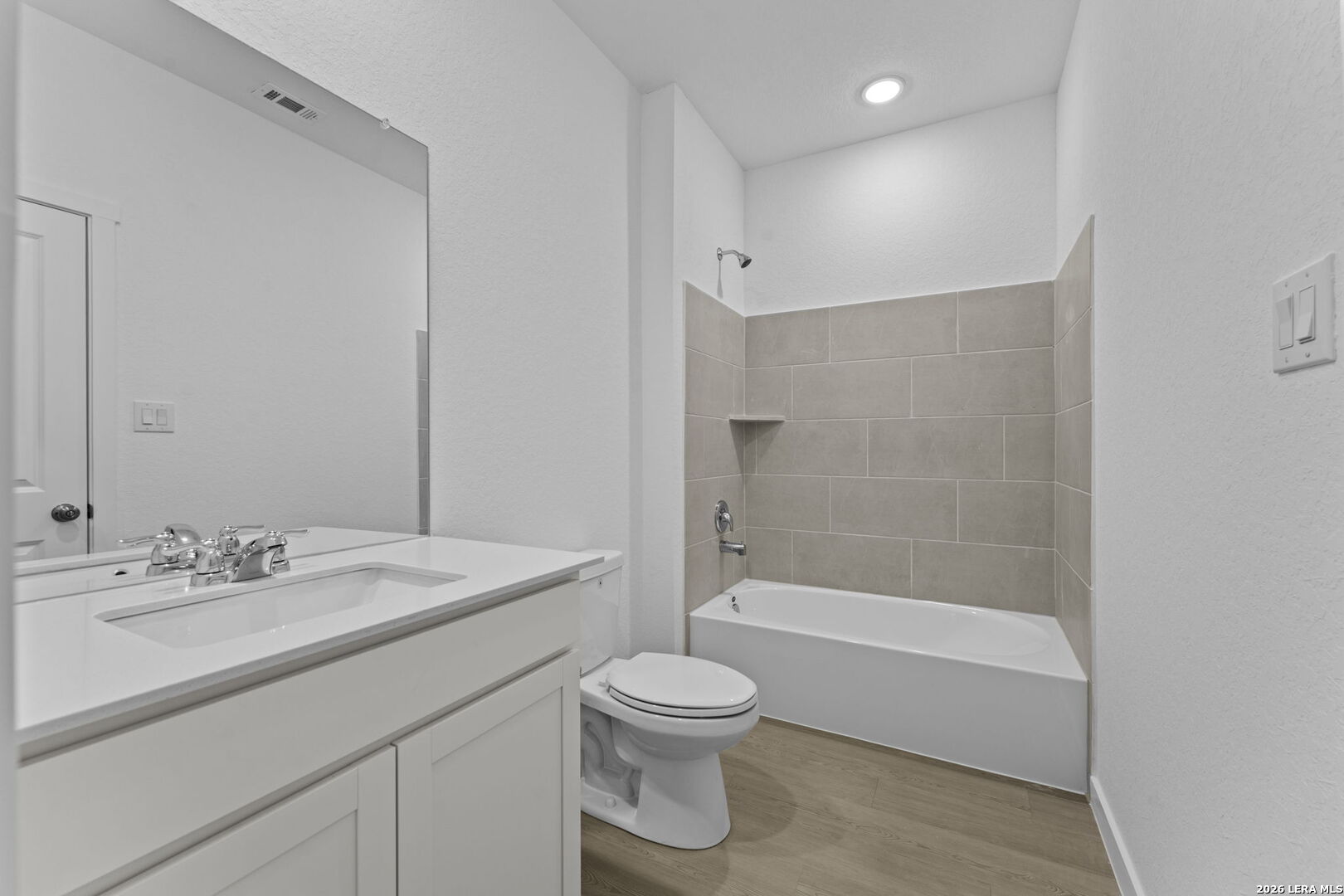 5003 Mission Tejas Road Marion, TX 78124 - Photo 12 of 25 a bathroom with a sink a toilet and a large mirror
