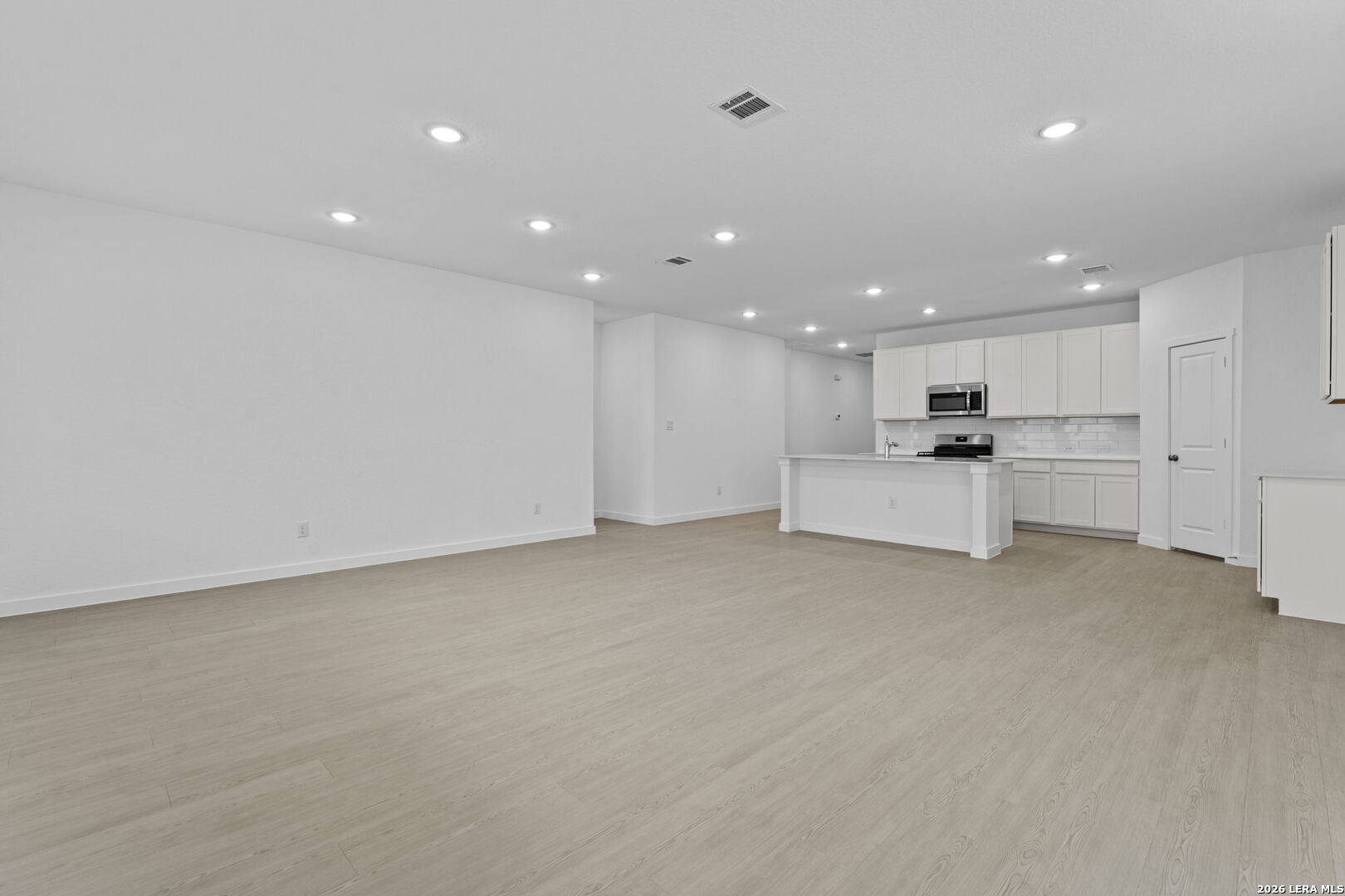 5003 Mission Tejas Road Marion, TX 78124 - Photo 19 of 25 a view of kitchen with refrigerator sink and wooden floor
