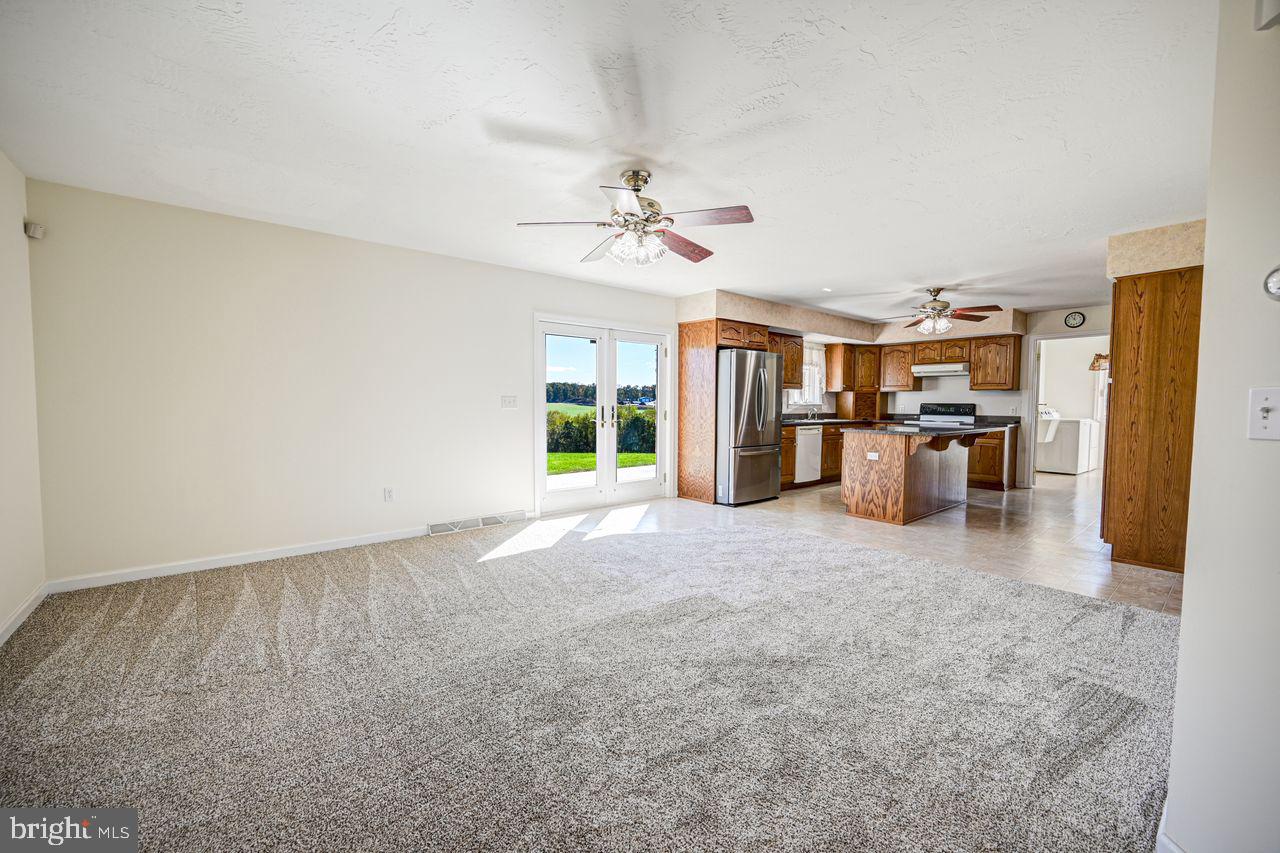 1537 Snyder Corner Road Red Lion, PA 17356 - Photo 11 of 50 a view of a kitchen with a sink and a refrigerator