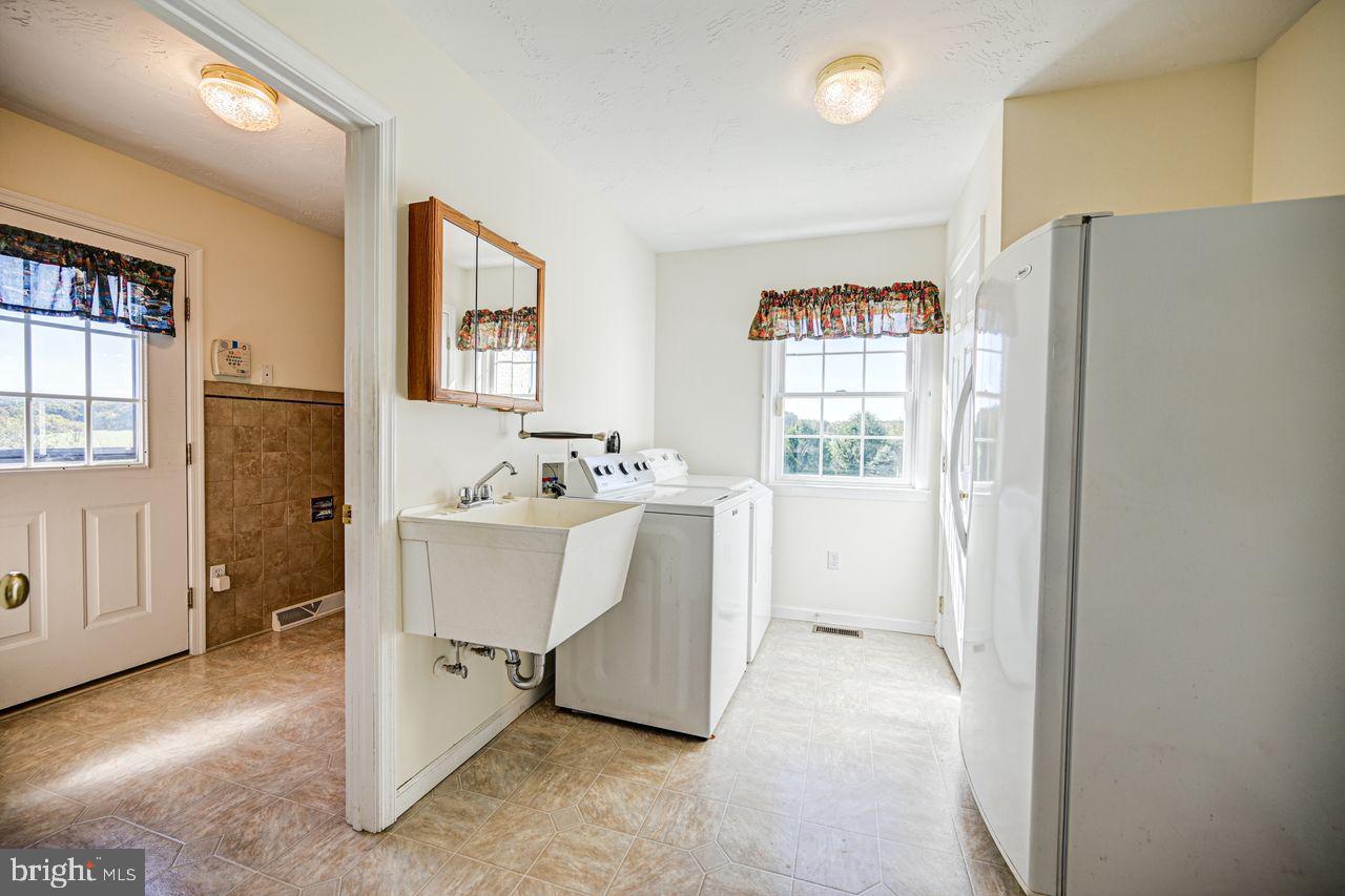 1537 Snyder Corner Road Red Lion, PA 17356 - Photo 20 of 50 a view of a hallway with white cabinets and window