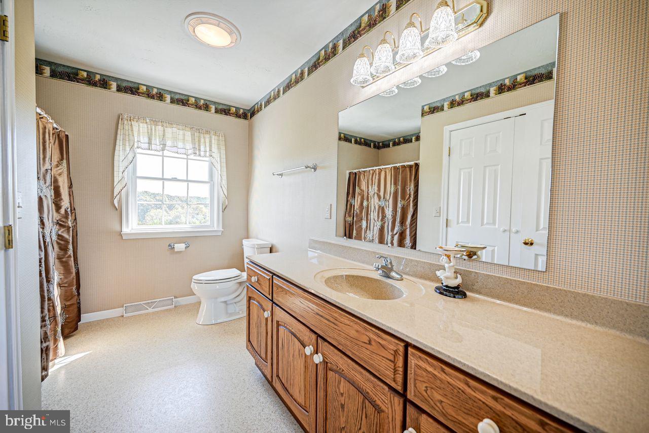 1537 Snyder Corner Road Red Lion, PA 17356 - Photo 23 of 50 a bathroom with a sink and a window