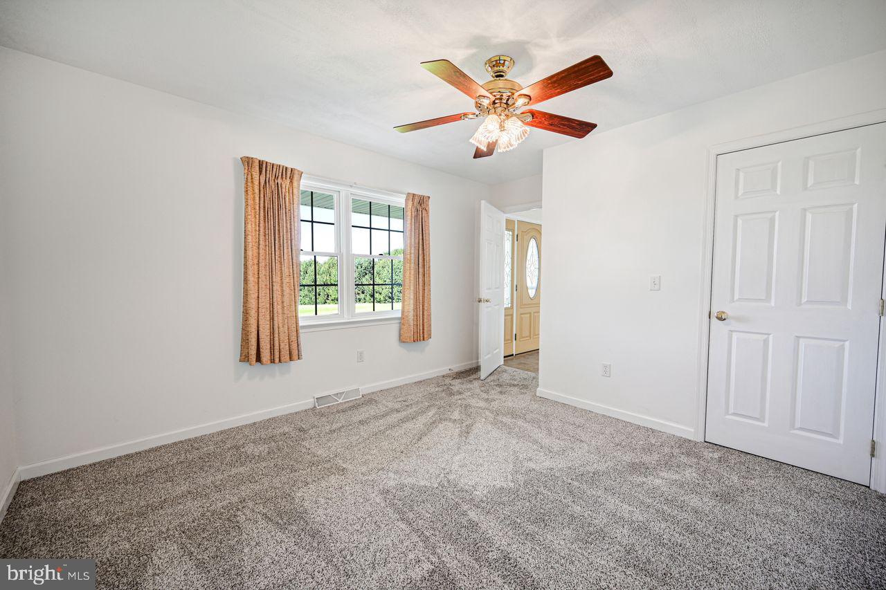 1537 Snyder Corner Road Red Lion, PA 17356 - Photo 34 of 50 a view of a livingroom with a ceiling fan and window