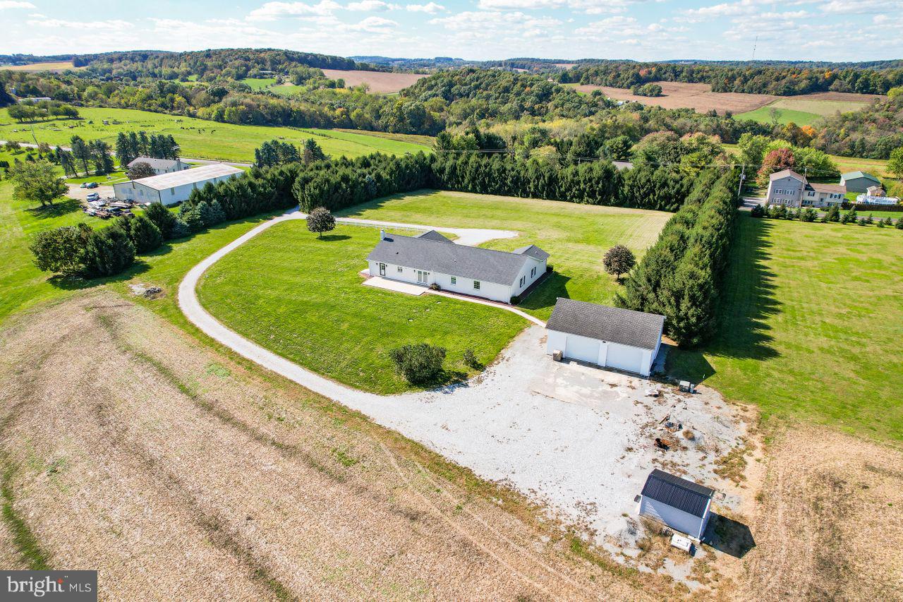 1537 Snyder Corner Road Red Lion, PA 17356 - Photo 5 of 50 an aerial view of a house with a garden and lake view